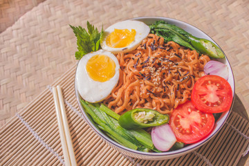 Delicious Fried Noodles on Unique Bamboo Woven Table 