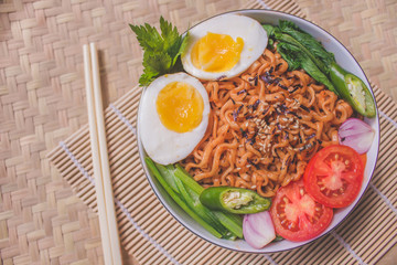 Delicious Fried Noodles on Unique Bamboo Woven Table 