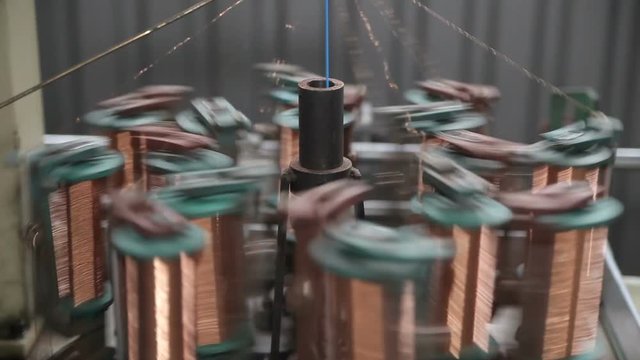 Winding of metal wire on a bobbin in production