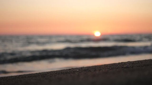 Aerial view of waves crashing on the beach at sunset, Video Shot in Sabaudia, a beautiful beach on the west coast of central Italy.