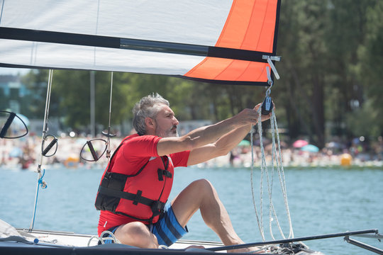 professional waterman training on lake with catamaran