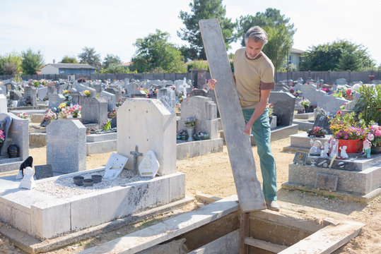 man working in cemetary