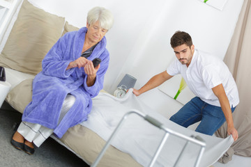 grandson helping his grandmother with housekeeping