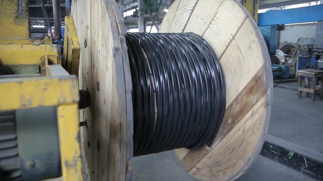 Winding of the electrical cable to the bobbin in the production