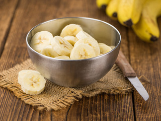 Portion of Sliced Bananas on wooden background, selective focus