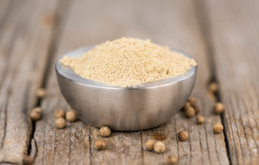 Portion of White Pepper on wooden background, selective focus
