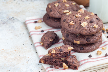 Homemade chocolate cookies with walnuts and chocolate chips on table , horizontal, copy space