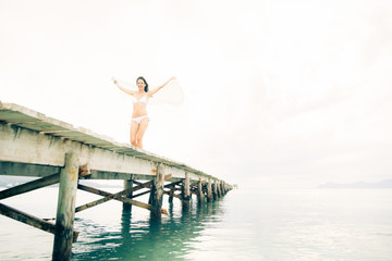 Fototapeta na wymiar Young Woman By The Sea