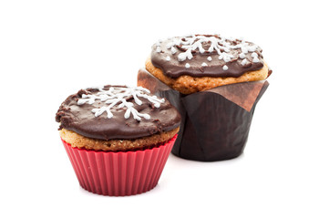 two chocolate cupcakes muffins isolated at white background