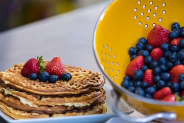 stack of waffles with berries