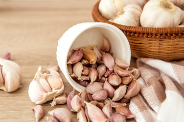 Close up the group of garlic on kitchen wooden table 