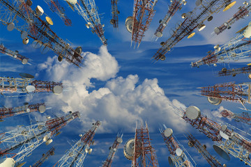 Antenna of cellular cell phone and communication system tower with cloud on center blue sky, Telecommunication tower perspective. technology concept.