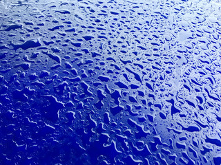 water drops on blue plastic surface background