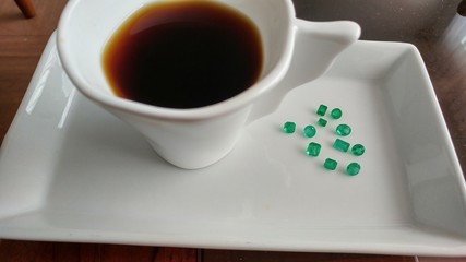 coffee cup with Colombian emeralds and  jade , jewelry  © photoworld