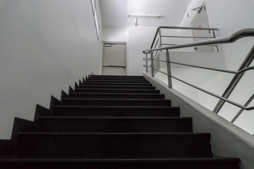 Old staircase with a handrail in a building