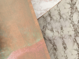 Rose gold texture and marble background, abstract layered geometric composition with overlay materials, sparkling, glossy and bright shades of pink and glitters in an elegant feminine wallpaper.