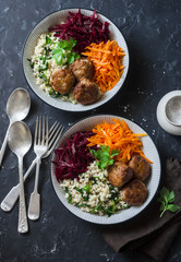 Fall buddha bowl. Bulgur, spinach, meatballs, beets, carrots - balanced healthy eating lunch. On a dark background, top view. Comfort autumn winter food