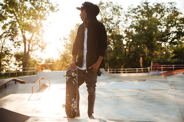 Young african man skateboarder standing © Drobot Dean