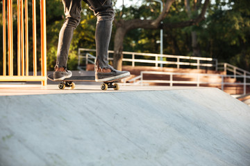 Close up of a young teenage skateboarder in action