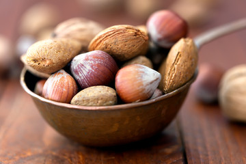 Almonds, walnuts and hazelnuts in metallic bowl