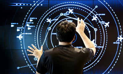 man control air traffic on touch screen in digital mornitor