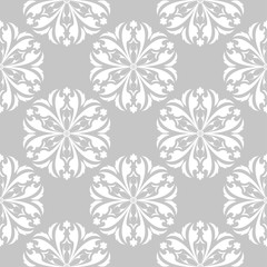 Fototapeta premium White floral seamless design on gray background