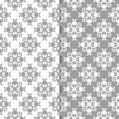 White and gray floral backgrounds. Set of seamless patterns