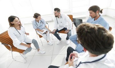 Fototapeta na wymiar doctors discuss an x-ray ,sitting in the office.