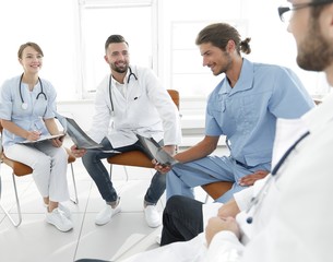 Fototapeta premium doctors discuss an x-ray ,sitting in the office.