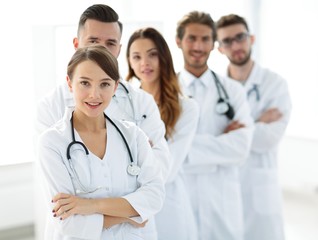 woman-pediatrician on the background of colleagues