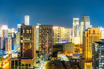 Obraz premium Bird view at Nanchang China. Skyscraper under construction in foreground. Fog, overcast sky and pollution. Bund (Nanchang) area