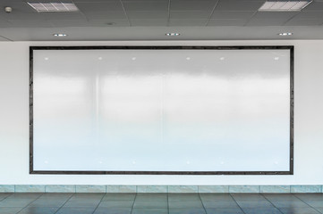 Blank billboard in interior airport hall