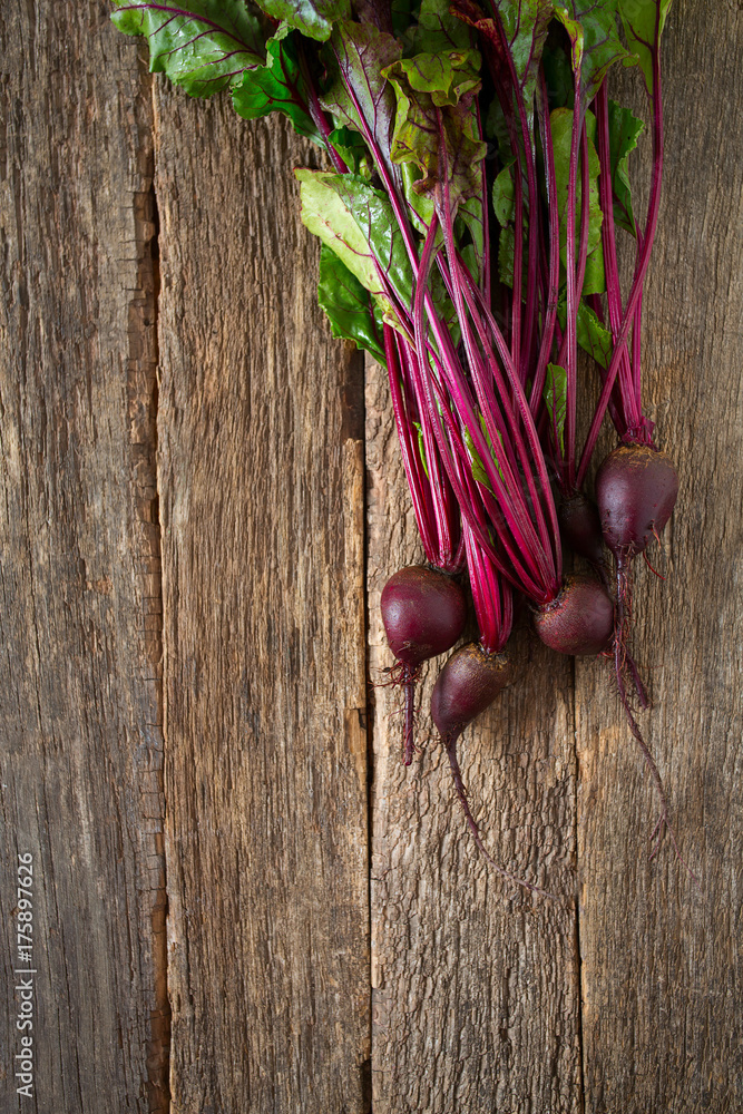 Poster beetroot on wooden surface