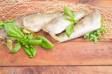 Carcasses of the notothenia fish  on a wooden surface closeup