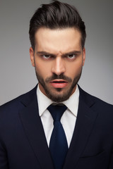 furious young business man looking like a mad man