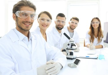 Fototapeta premium Male scientist and the team in the lab.