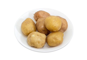 Potatoes boiled in their skins on a white dish