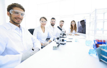 Fototapeta premium Male scientist and the team in the lab.