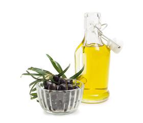 Black olives, olive oil and olive branch