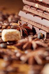 Aroma coffee chocolate cookies and spices on the wooden table. Dark wooden background. Top view. Close. Closeup.