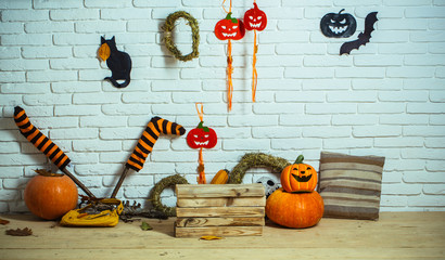 Halloween traditional symbols on wooden and brick background