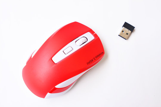 Wireless mouse red color with receiver signal on white color background - IT equipment accessories of concept