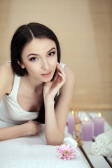 Obraz na płótnie Canvas Cute young woman enjoying during a skin care treatment at a spa.