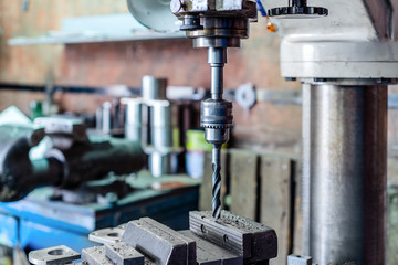 Drilling machine. The drill bit is installed in the drill chuck.