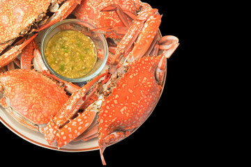 Steamed crab on the dish with isolated black color background - Sea food buffet of crab concept in the restaurant