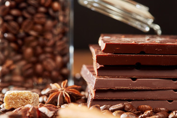 Aroma coffee chocolate cookies and spices on the wooden table. Dark wooden background. Top view. Close. Closeup.