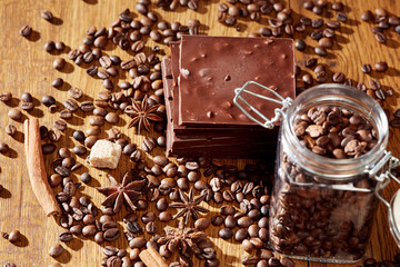 Aroma coffee chocolate cookies and spices on the wooden table. Dark wooden background. Top view. Close. Closeup.