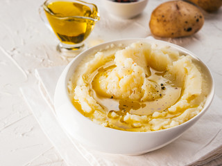 Mashed potatoes on white concrete background