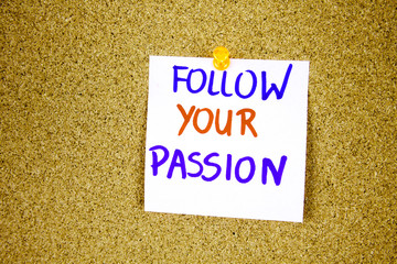follow your passion on Sticky note with inscription pinned on a cork bulletin board