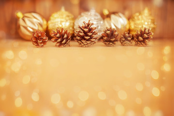 Pine cones on wooden background.